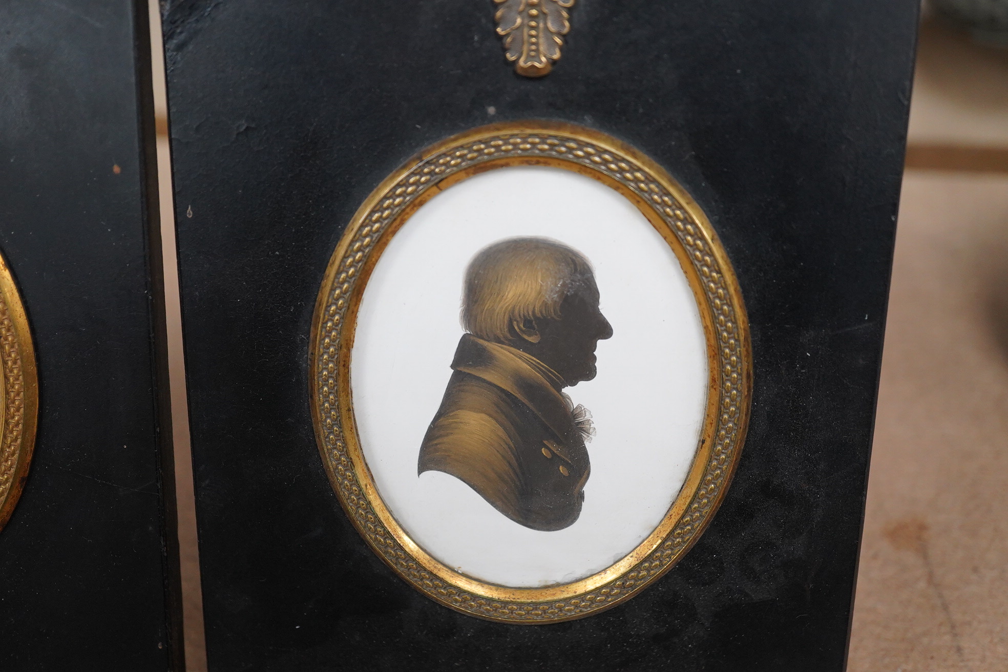 Miers & Field, two bronzed painted plaster silhouettes of gentlemen, framed. Condition - good